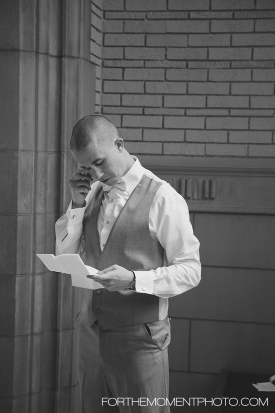 Groom shedding a tear reading a letter from the bride
